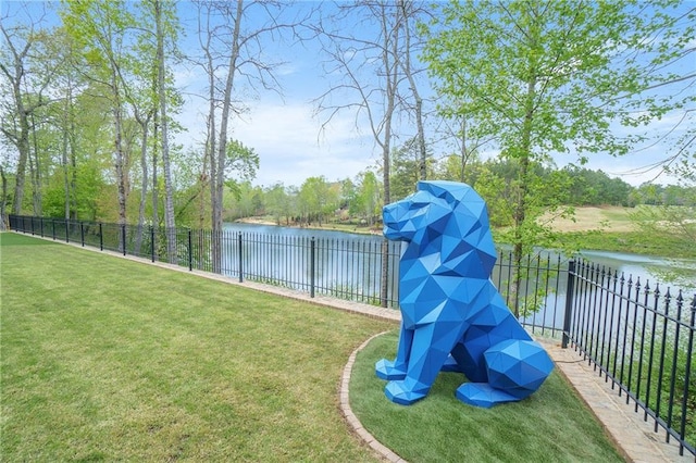 view of jungle gym with a water view and a yard