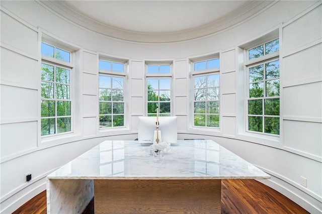 dining area featuring crown molding and dark hardwood / wood-style flooring