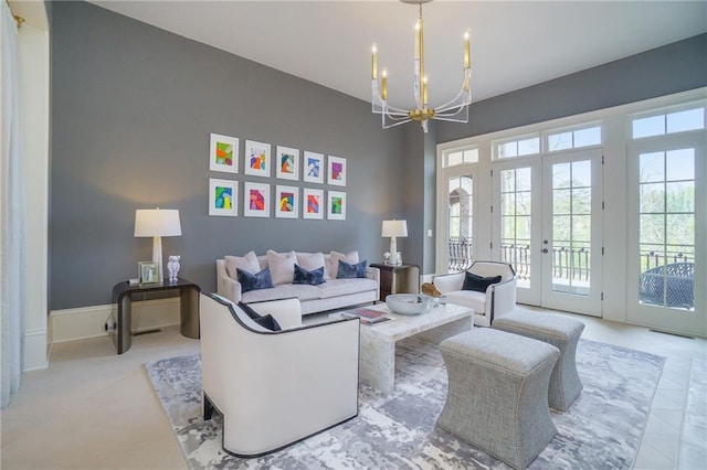 living room featuring a chandelier and french doors