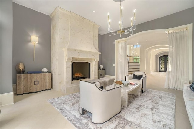 tiled living room with a notable chandelier and a fireplace