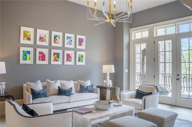 living room featuring a chandelier, french doors, a wealth of natural light, and light tile flooring