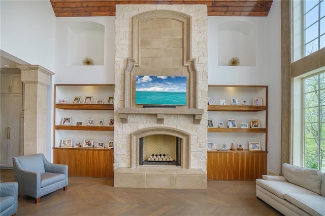 living room featuring parquet floors and a fireplace