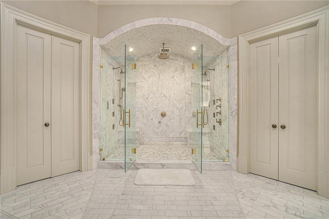 bathroom with walk in shower and tile floors