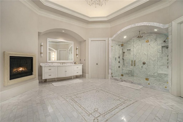 bathroom with crown molding, tile flooring, a shower with door, and large vanity