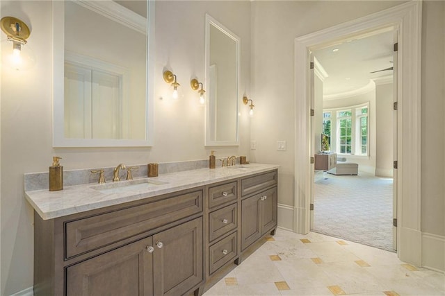 bathroom with ornamental molding, dual sinks, tile floors, and oversized vanity