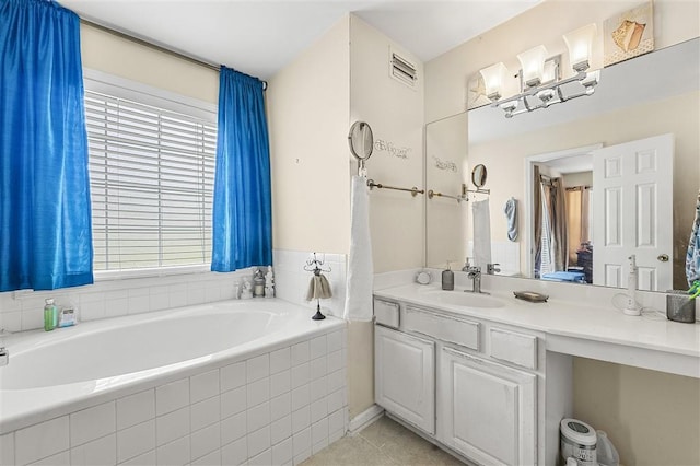 3485 Palisade Lake Dr, Duluth, GA 30096 - bathroom featuring a garden tub, plenty of natural light, vanity, and tile patterned floors
