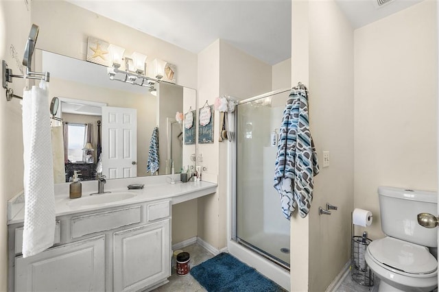3485 Palisade Lake Dr, Duluth, GA 30096 - full bathroom with a shower stall, baseboards, vanity, and toilet