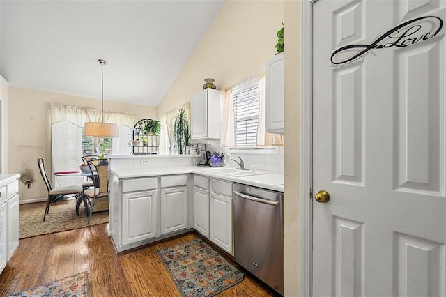 3485 Palisade Lake Dr, Duluth, GA 30096 - kitchen featuring stainless steel dishwasher, a sink, a peninsula, light countertops, and dark wood-style floors