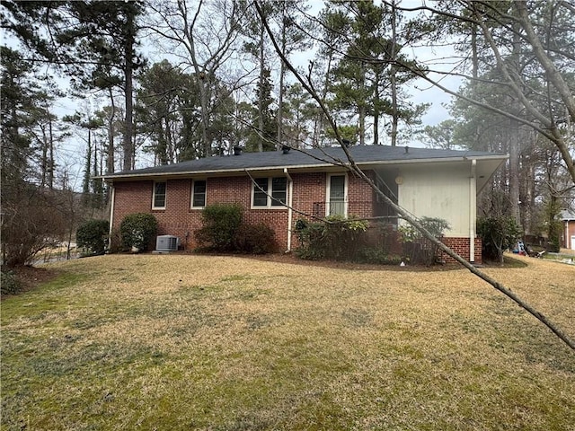 1376 Woodbine St, Marietta, GA 30062 - view of side of property with a yard, central air condition unit, and brick siding