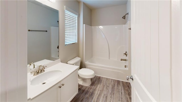 full bathroom featuring shower / washtub combination, toilet, vanity, and hardwood / wood-style flooring