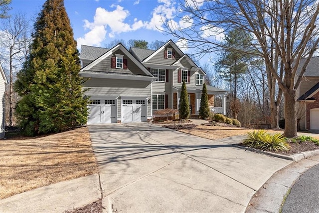 view of front of property featuring driveway and a garage