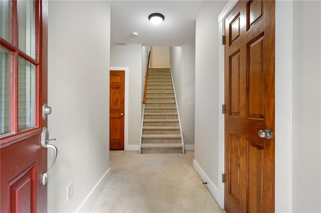 entrance foyer with light colored carpet