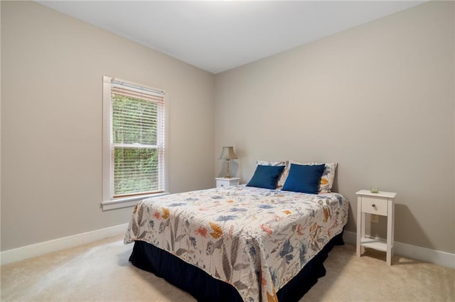 bedroom with light carpet