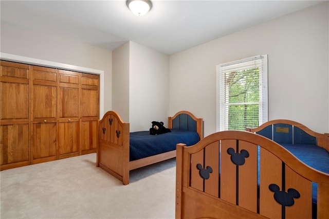 carpeted bedroom featuring a closet