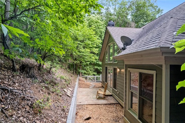 view of side of property with a patio area