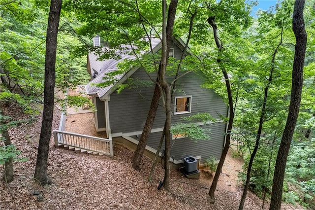 view of side of home featuring central air condition unit