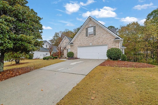 front facade with a garage and a front lawn