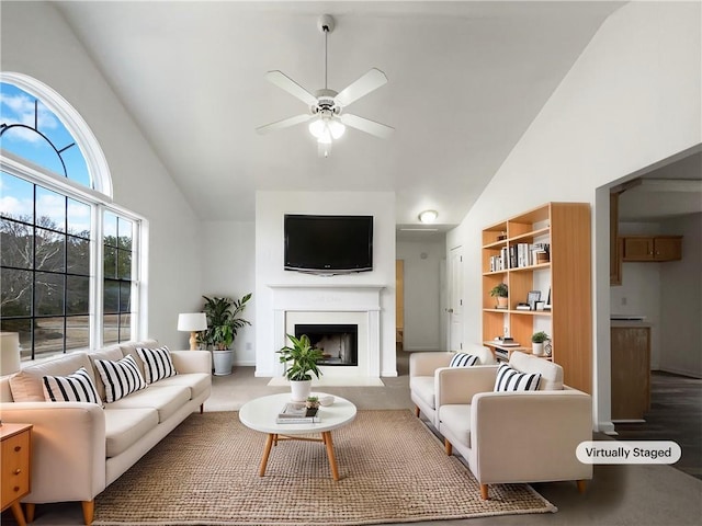 living room featuring lofted ceiling and ceiling fan