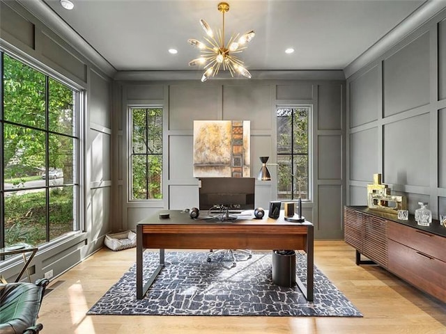 office space with light hardwood / wood-style floors and a notable chandelier