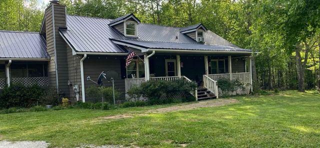 view of front of home featuring a front lawn and a porch