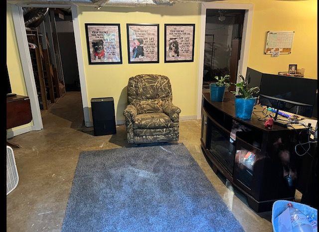 living area featuring concrete flooring