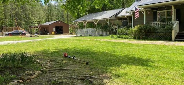 view of yard featuring covered porch