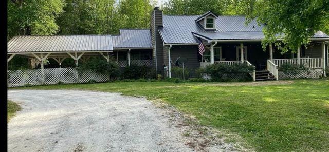 view of front of house with a front lawn and a porch