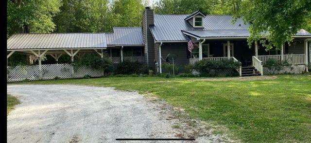 view of front of house with a front lawn and a porch