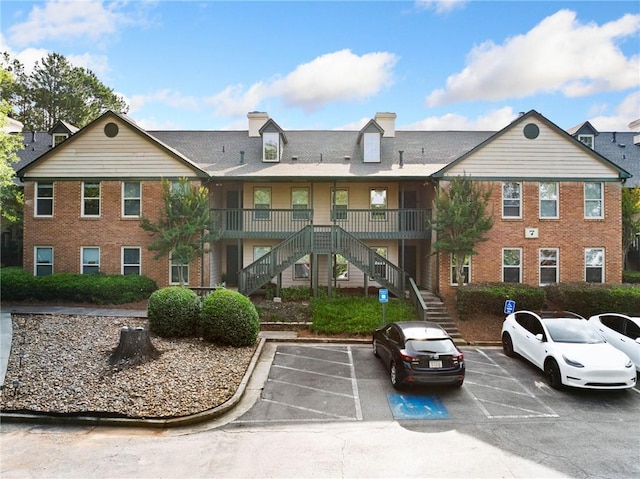 717 Beaufort Cir, Duluth, GA 30096 - view of property with stairway and uncovered parking