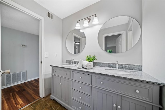 717 Beaufort Cir, Duluth, GA 30096 - bathroom with double vanity and baseboards