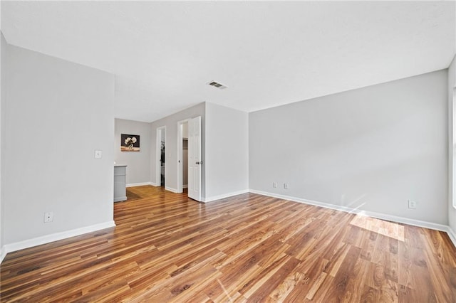 717 Beaufort Cir, Duluth, GA 30096 - unfurnished living room featuring wood finished floors and baseboards