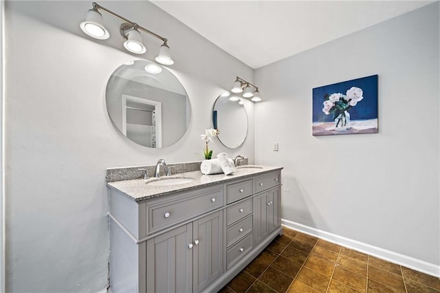 717 Beaufort Cir, Duluth, GA 30096 - bathroom featuring baseboards and double vanity