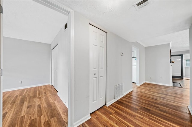 717 Beaufort Cir, Duluth, GA 30096 - hallway with wood finished floors, baseboards, and a textured ceiling