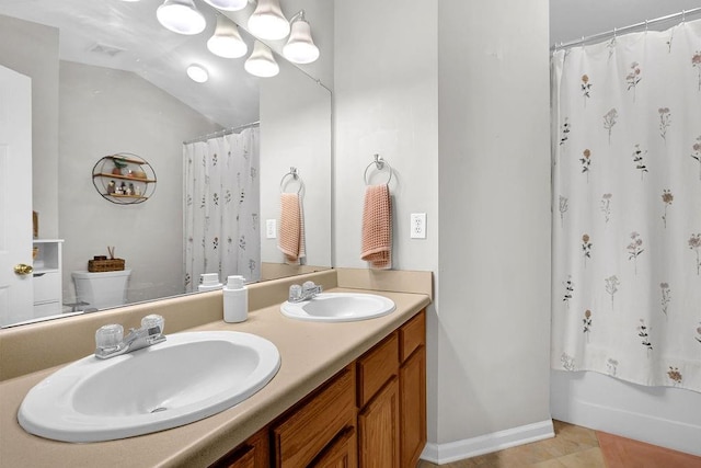 full bathroom with shower / bath combo, vanity, vaulted ceiling, tile patterned flooring, and toilet