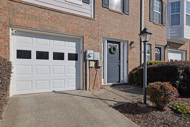 doorway to property featuring a garage