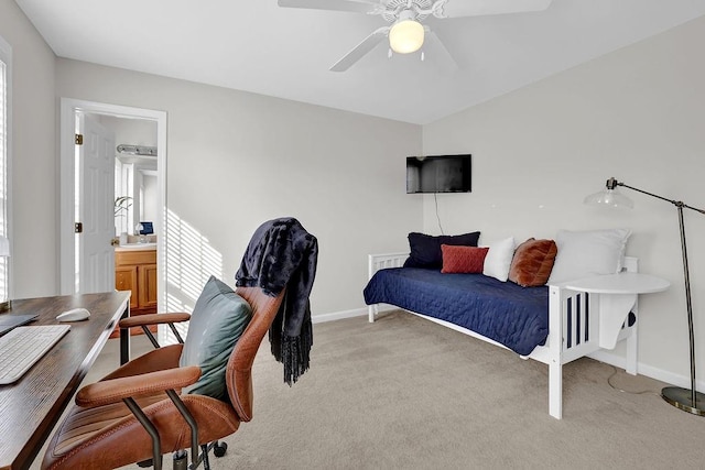 carpeted bedroom with ceiling fan and ensuite bathroom