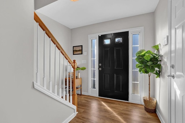 entryway with hardwood / wood-style flooring