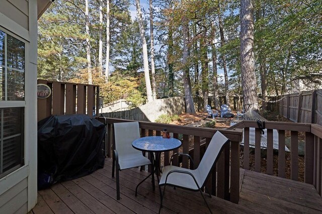 wooden terrace with grilling area