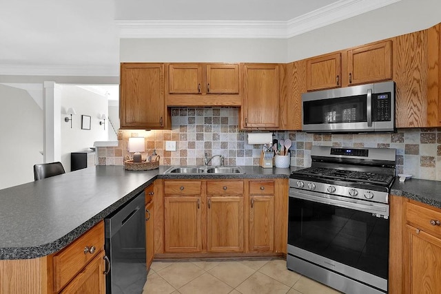 kitchen with backsplash, sink, ornamental molding, and stainless steel appliances