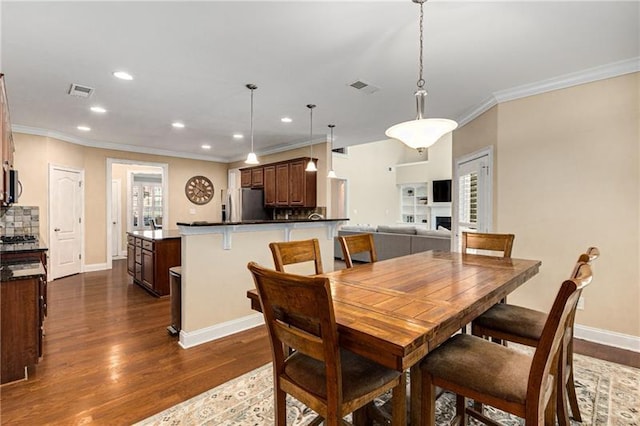 1725 Lynwood Pl, Alpharetta, GA 30004 - dining room with ornamental molding, dark wood-type flooring, recessed lighting, and baseboards