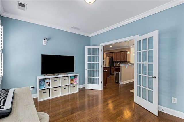 1725 Lynwood Pl, Alpharetta, GA 30004 - living area featuring french doors, ornamental molding, dark wood finished floors, and baseboards