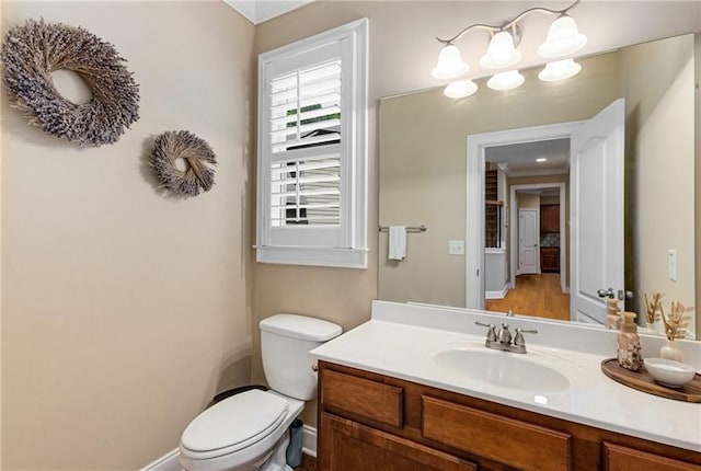 1725 Lynwood Pl, Alpharetta, GA 30004 - bathroom with toilet, vanity, and baseboards