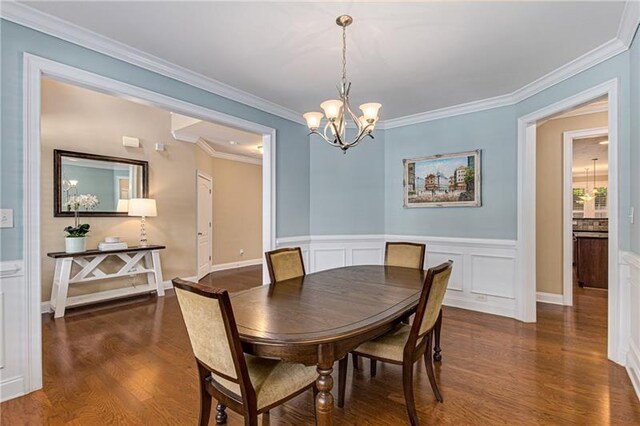 1725 Lynwood Pl, Alpharetta, GA 30004 - dining space with a chandelier, wood finished floors, ornamental molding, and wainscoting