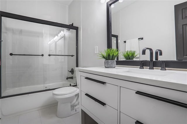 bathroom with toilet, shower / bath combination with glass door, and vanity