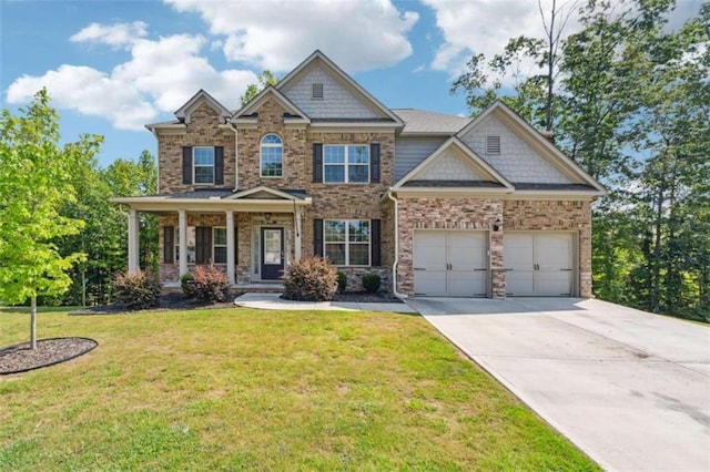 craftsman-style home featuring a porch, a garage, and a front lawn