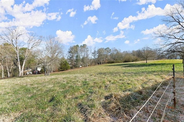 view of yard with a rural view