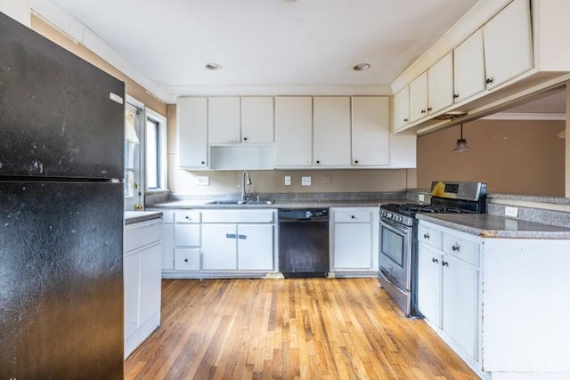 kitchen with white cabinetry, sink, light hardwood / wood-style flooring, and black appliances