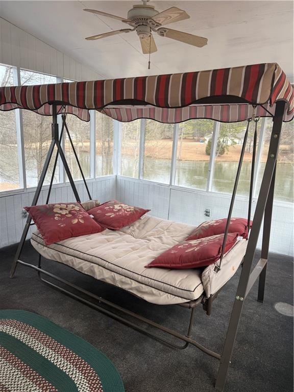 bedroom with ceiling fan and dark hardwood / wood-style floors