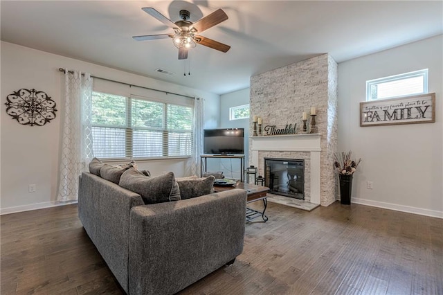 3291 Wild Basil Ln, Buford, GA 30519 - living area featuring a ceiling fan, wood finished floors, and a fireplace