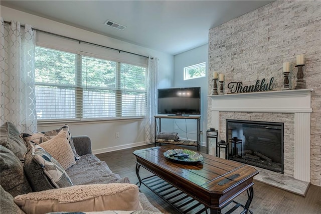 3291 Wild Basil Ln, Buford, GA 30519 - living room with wood finished floors and a stone fireplace